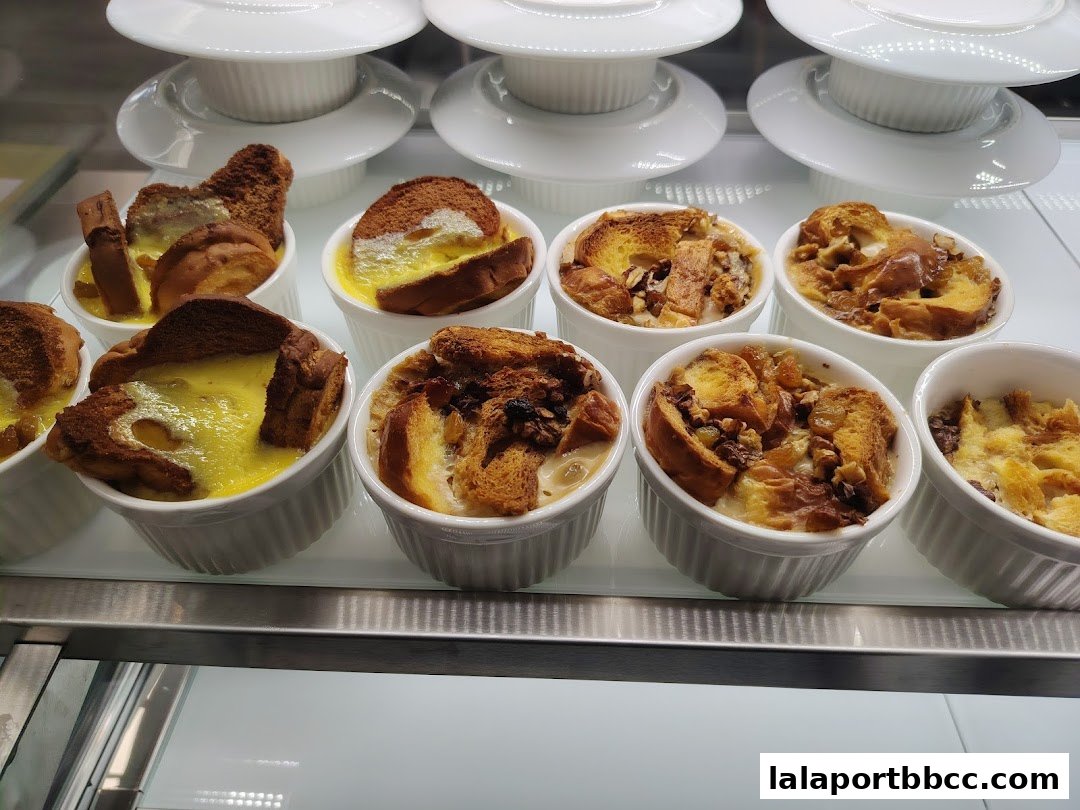 A display of individual servings of bread pudding in white ramekins.