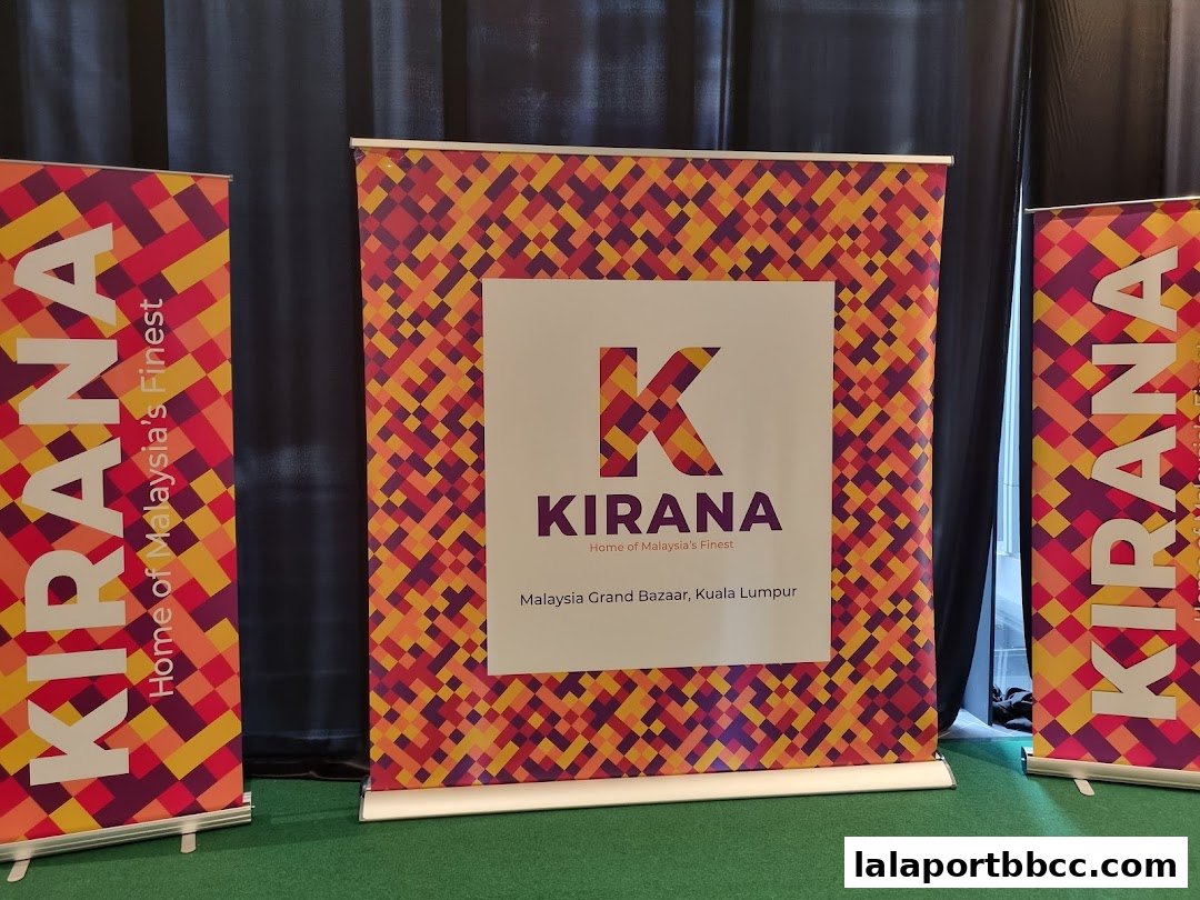 Banners and a display board with the KIRANA logo and branding.