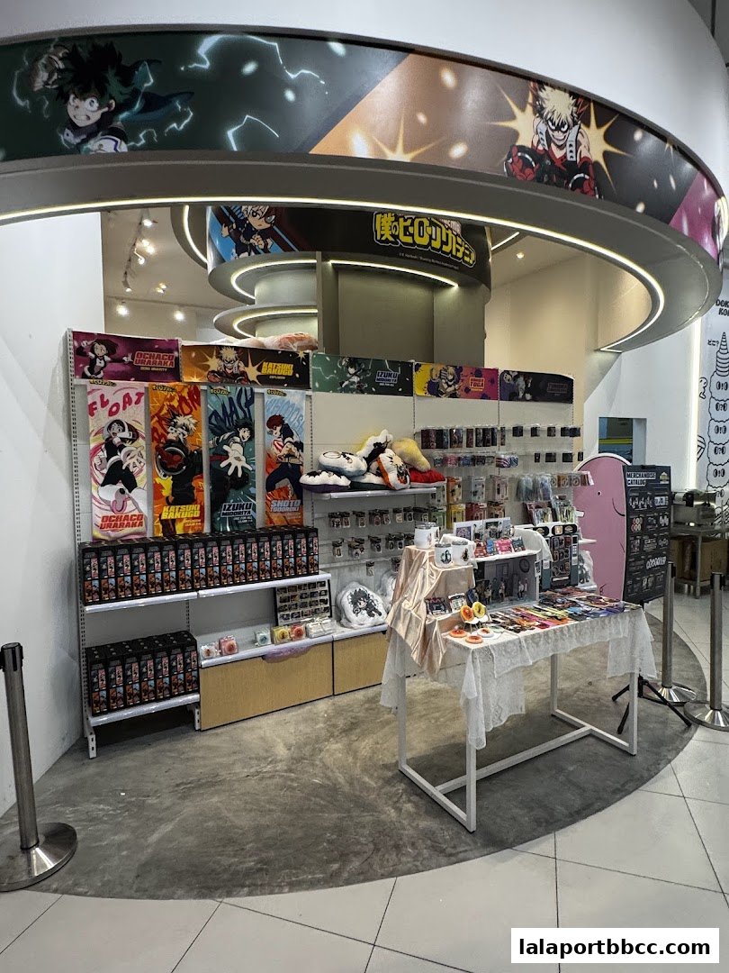 A retail shop displaying merchandise featuring anime characters, including posters, plush toys, and accessories.