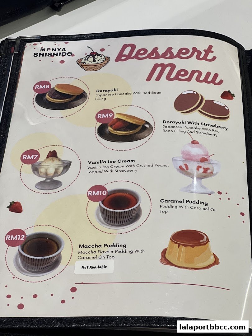 A dessert menu from Menya Shishido featuring Dorayaki, Vanilla Ice Cream, Maccha Pudding, and Caramel Pudding.