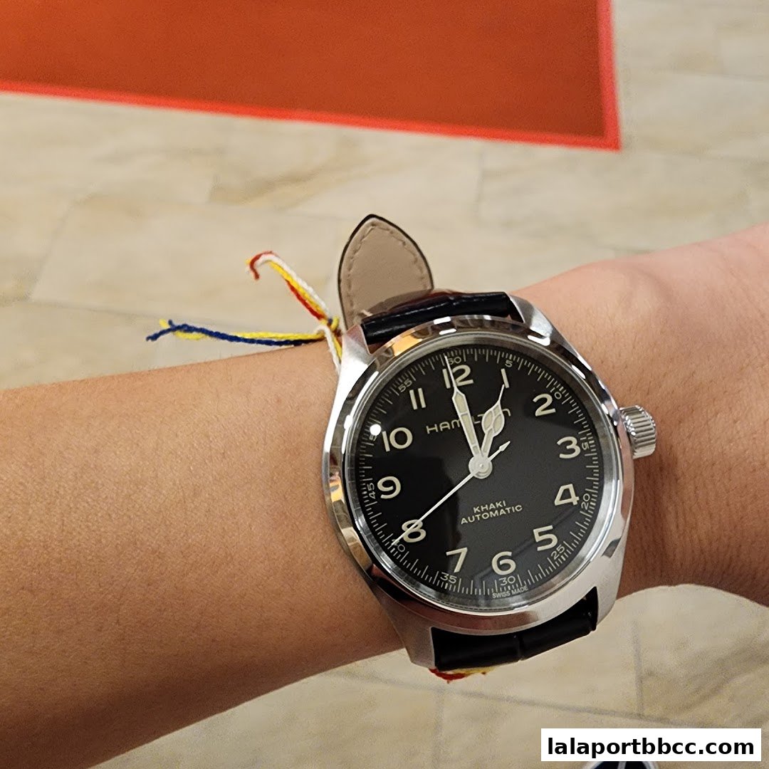 A close-up shot of a Hamilton Khaki Automatic watch on a wrist.