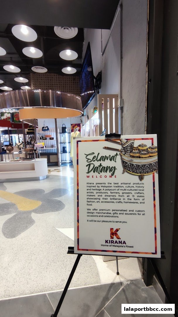 A welcome sign outside a shop called Kirana, showcasing Malaysian artisanal products.