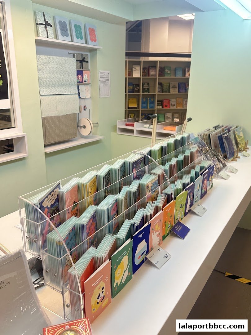 A display of colorful greeting cards and stationery items in a retail shop.