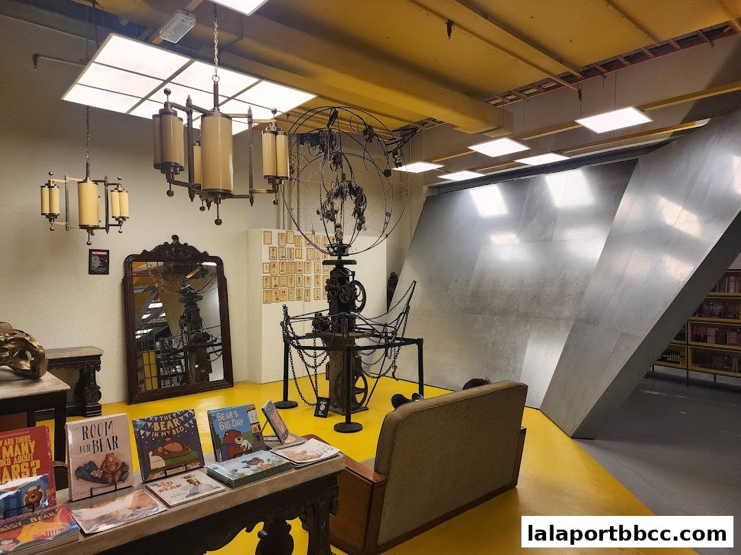 Interior of a bookstore with books displayed, unique decor, and seating.