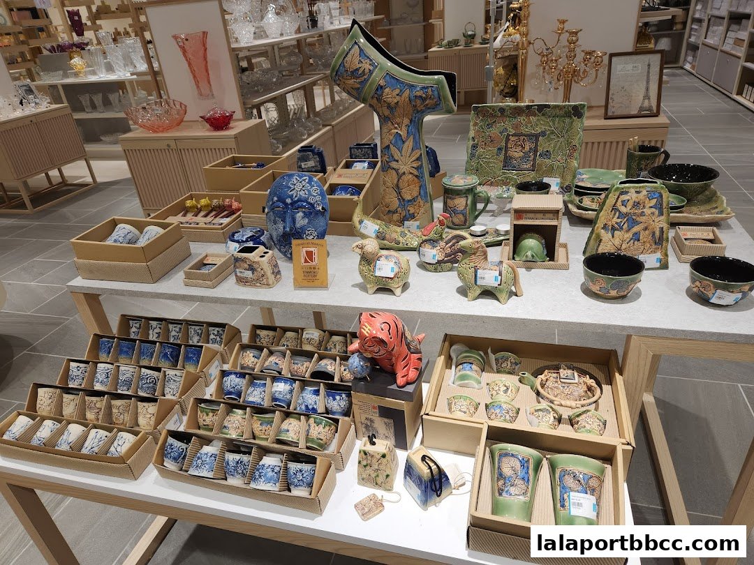 A display of decorative ceramic pottery, including vases, bowls, and animal figurines.
