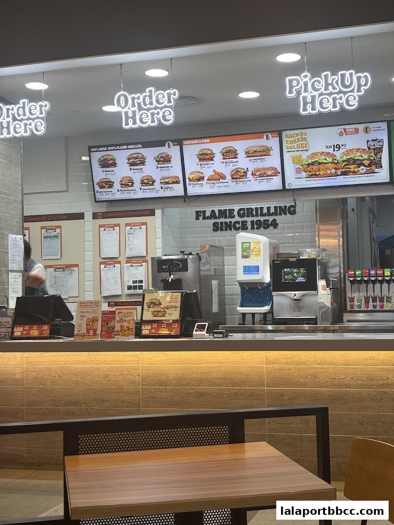 Burger King counter with menus, ordering stations, and drink dispensers.