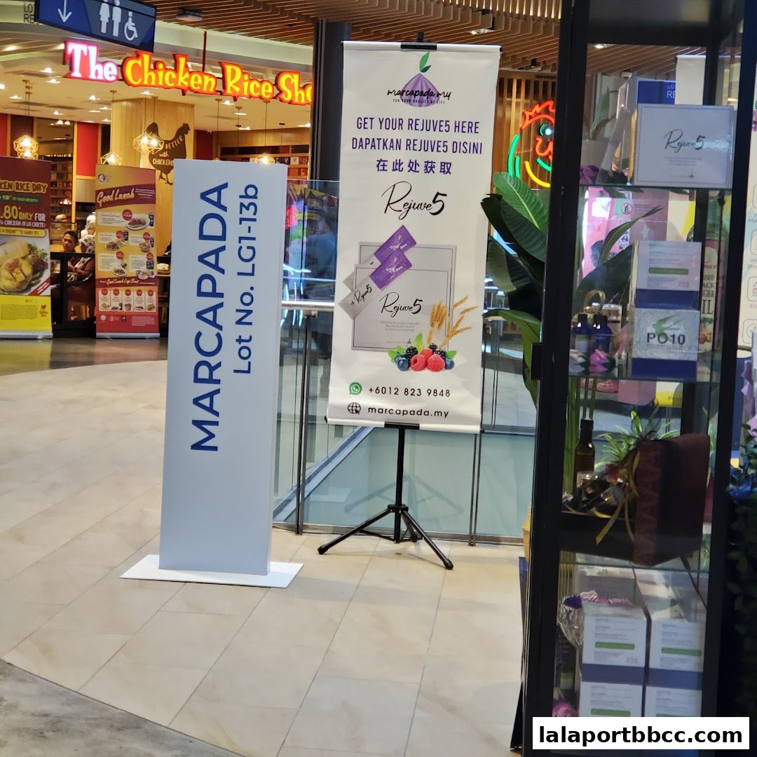A shop display featuring a sign for MARCAPADA and promotional banners for Rejuve5.