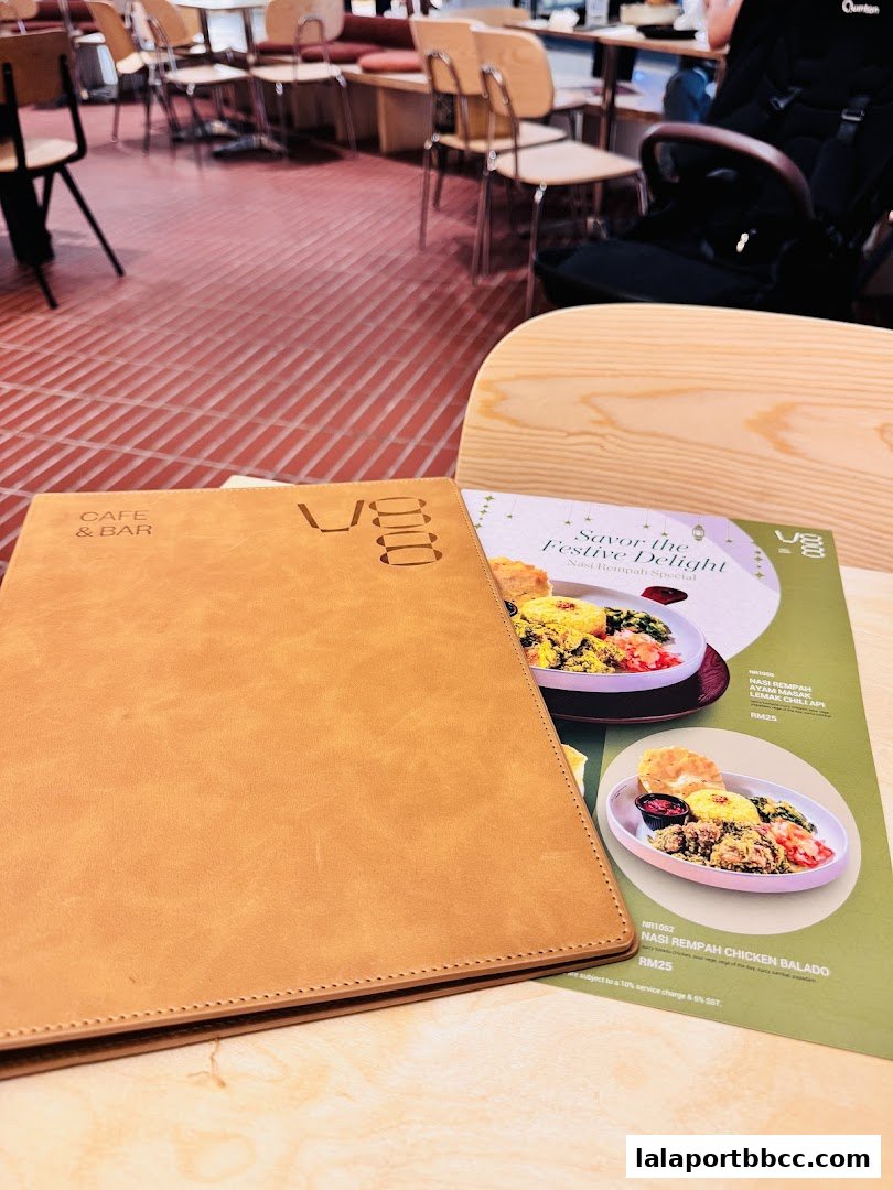 A menu from V88 Cafe and Bar with food items and prices displayed.