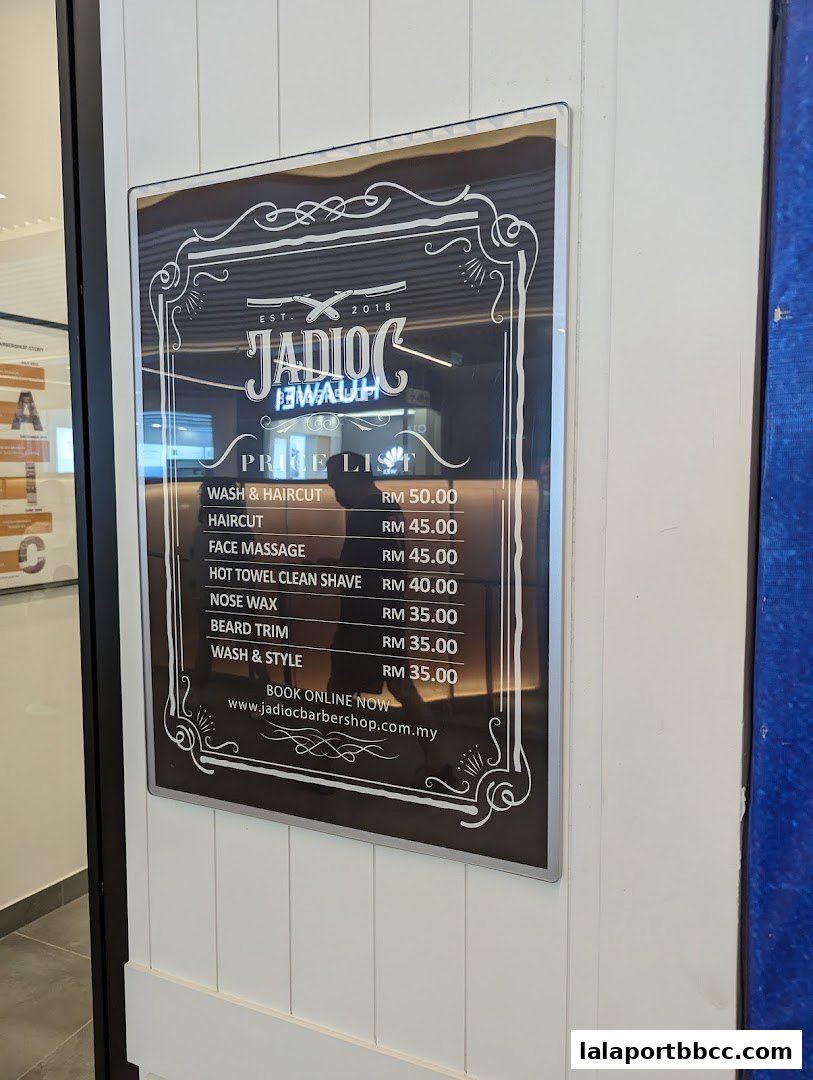 A price list for Jadioc Barbershop, featuring services like wash & haircut and beard trim.