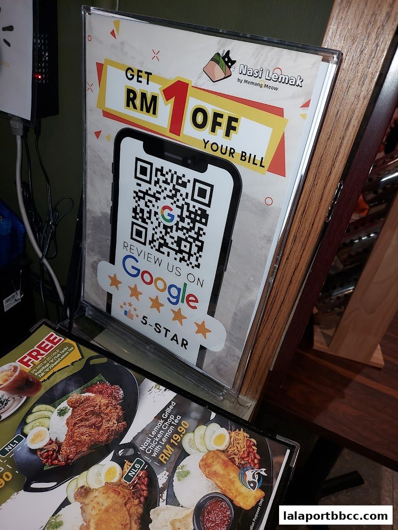 A sign offering RM1 off with a QR code to review on Google, and menu items displayed below.