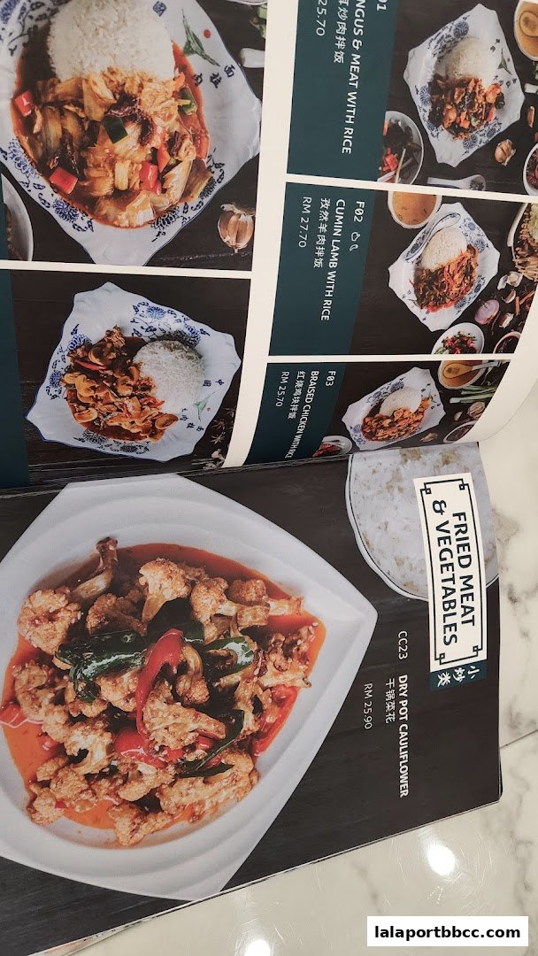 A menu featuring various meat and vegetable dishes with rice, including braised chicken and cauliflower.
