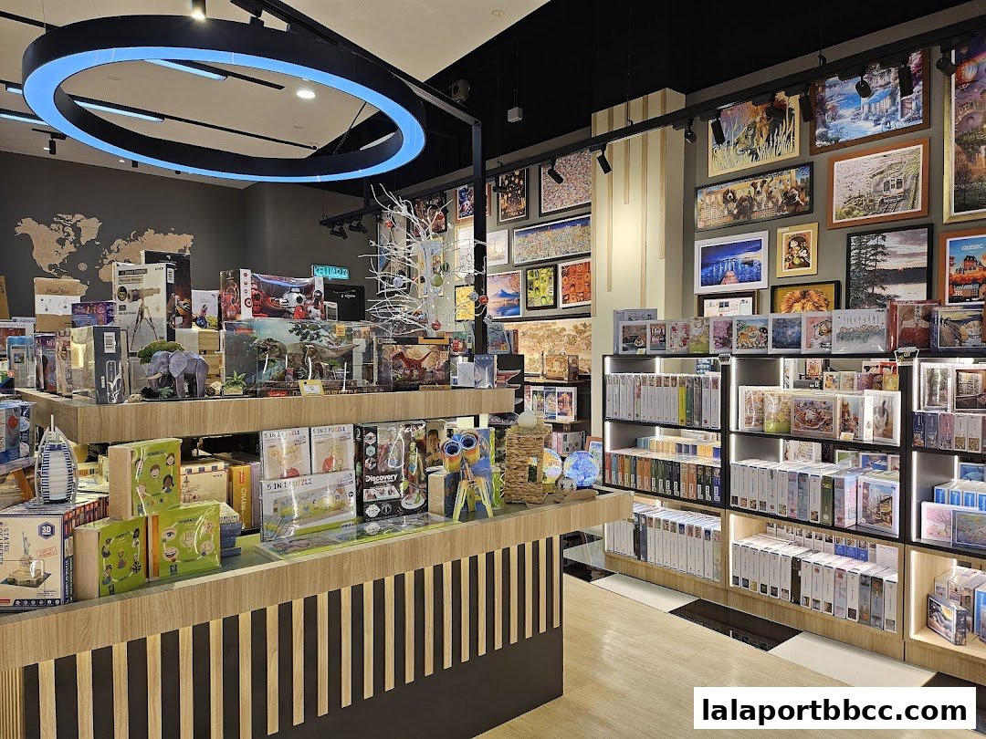 Interior view of a shop filled with puzzles and educational toys, featuring shelves stocked with puzzle boxes.