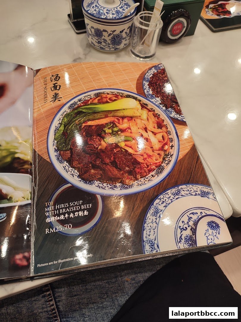 A menu featuring a bowl of Mee Hiris Soup with Braised Beef and its price.