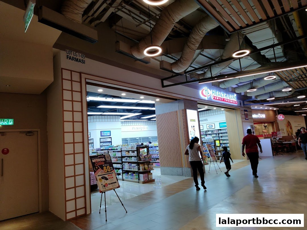 The entrance to Health Lane Family Pharmacy, showcasing shelves of products and promotional displays.