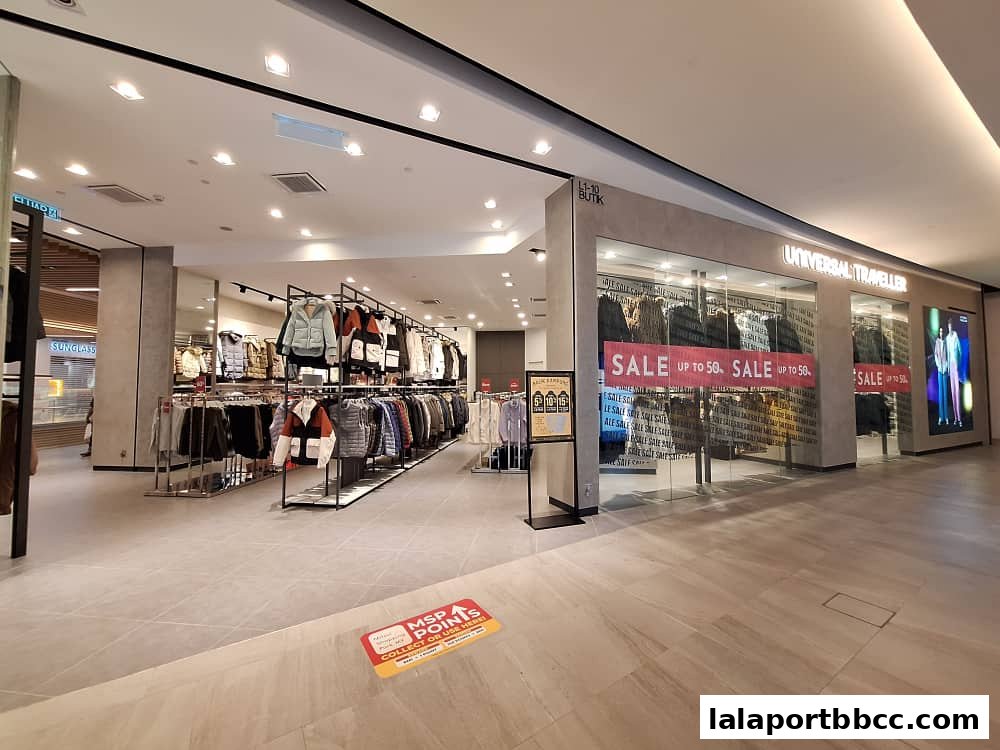 The Universal Traveller shop front with clothing displays and sale banners.