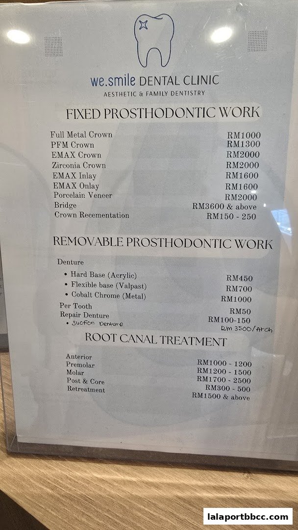 A price list for dental services including fixed and removable prosthodontics, and root canal treatments.