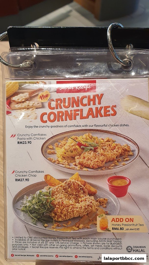 A menu featuring Secret Recipe's Crunchy Cornflakes dishes and a Honey Passionfruit Tea add-on.