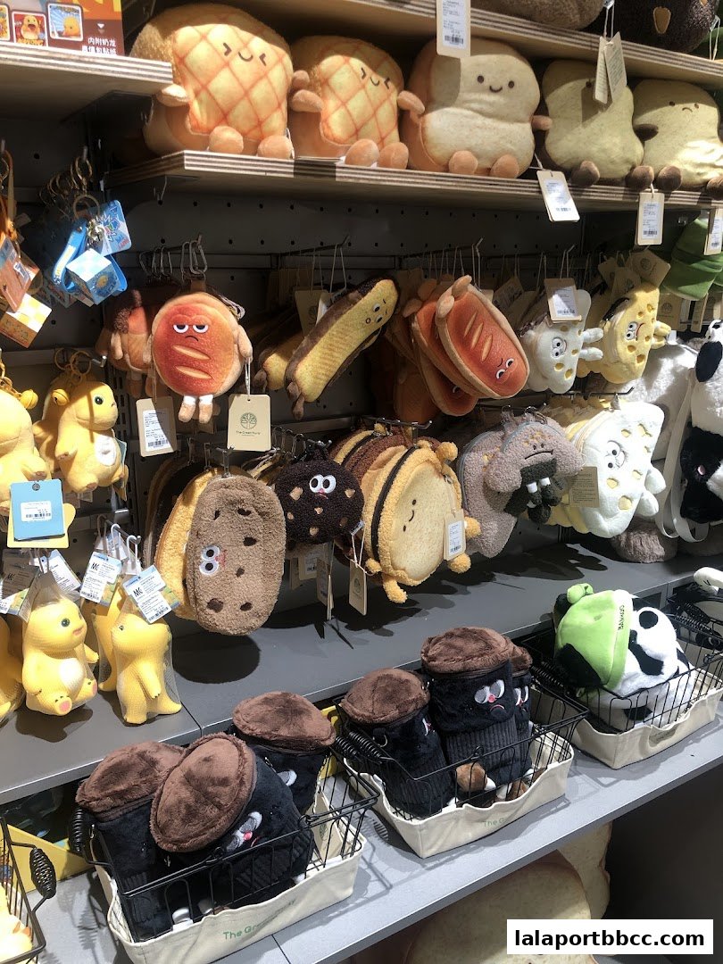 A display of cute, food-themed plush toys and accessories on shelves.