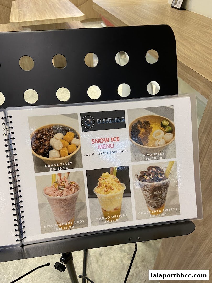 A menu from Iceberg LaLaport showcasing various snow ice desserts with prices.