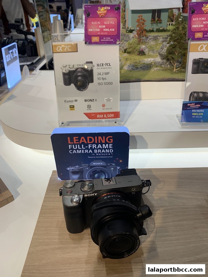 Sony Alpha 7C camera and promotional displays inside a Sony Store.