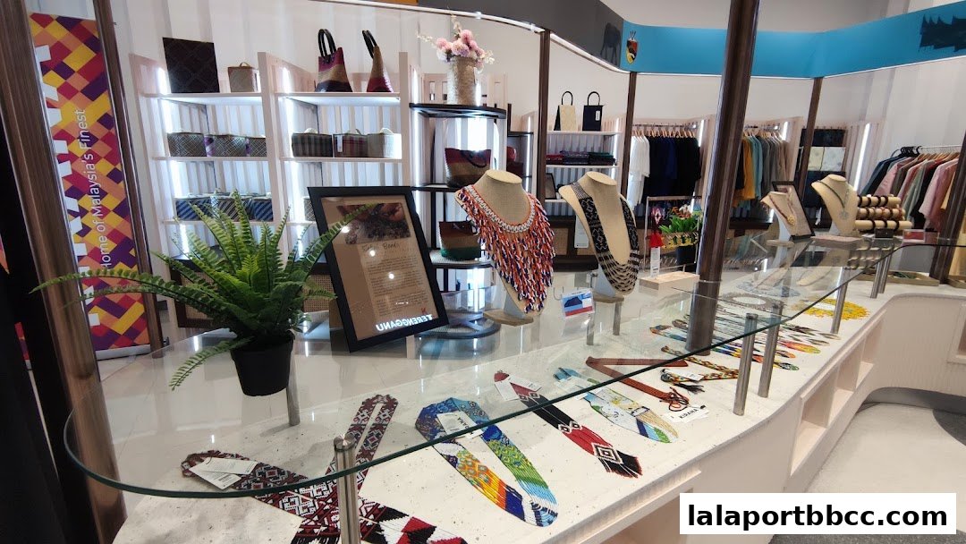 Interior view of a shop displaying traditional Malaysian crafts and jewelry.
