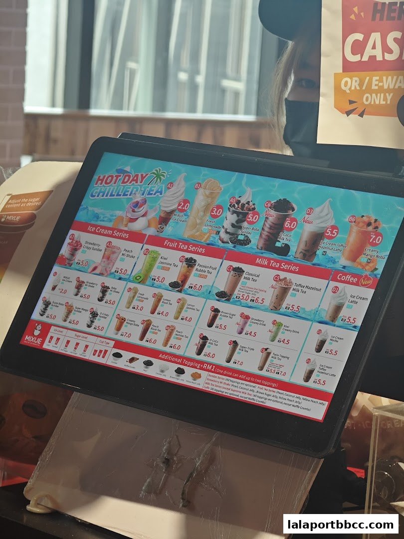 A digital menu displaying various chilled teas, ice cream sundaes, and milk teas with prices.