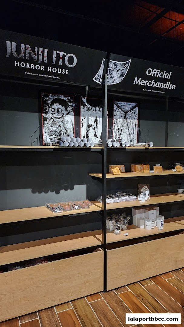 Shelves display official merchandise from the Junji Ito Horror House, featuring artwork and various products.