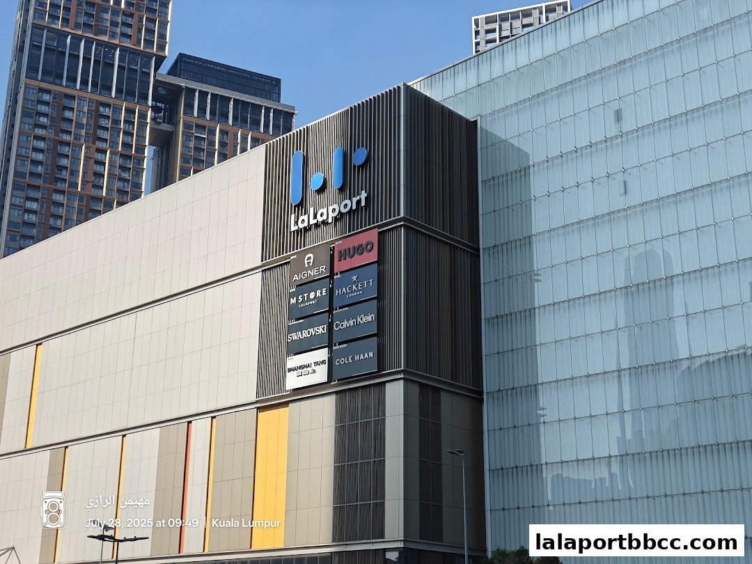 Exterior view of LaLaport KL mall with various brand signs visible.
