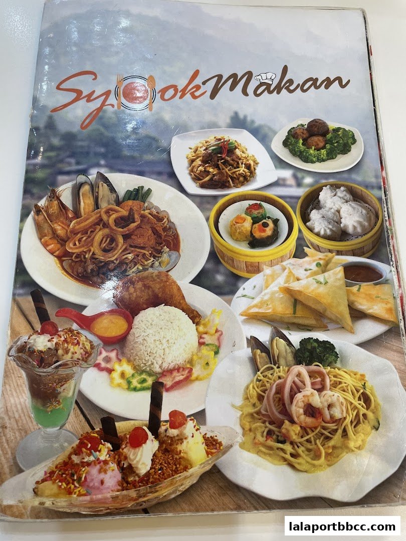 A menu from Restorant Syok Makan showcasing various delicious dishes and desserts.