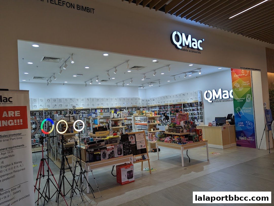 The QMac mobile accessories shop interior, showcasing a wide range of products and displays.