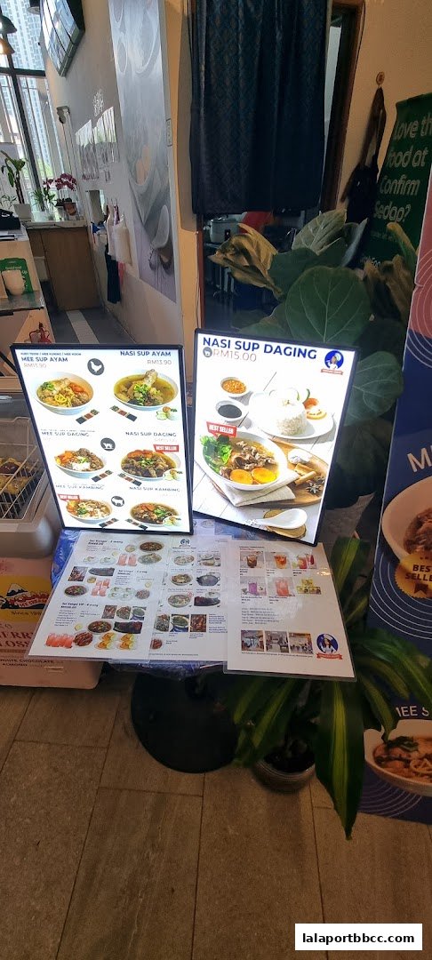 A display of menus and food items at Confirm Sedap restaurant.