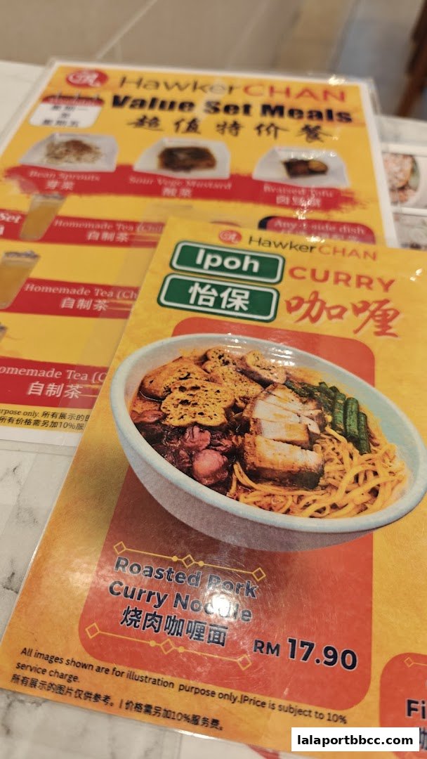 A menu from Hawker Chan featuring value set meals and a signature Roasted Pork Curry Noodle.