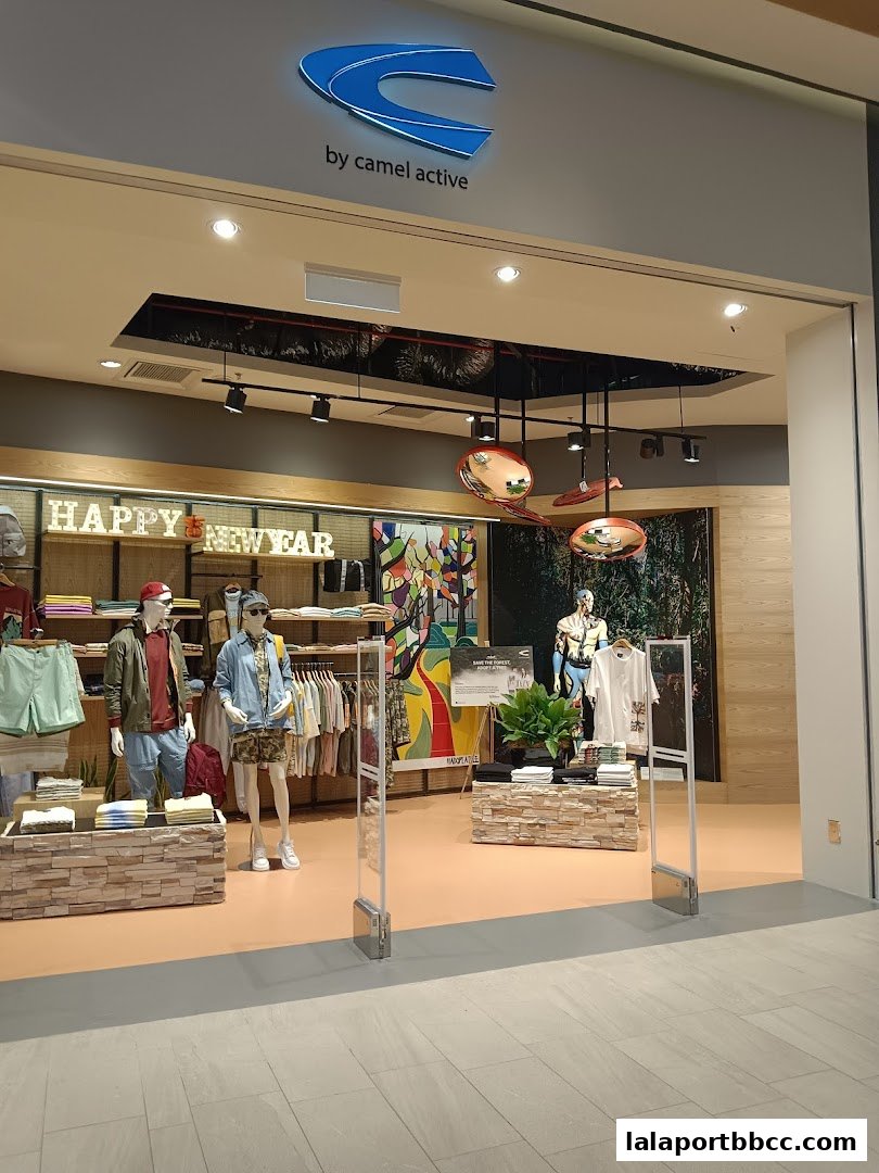 The entrance of a Camel Active clothing store with mannequins and merchandise displayed.