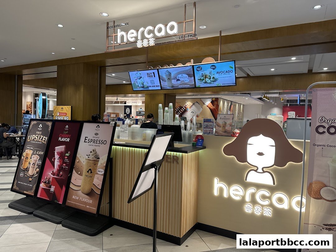 The Hercaa shop front with promotional displays and a distinctive logo.