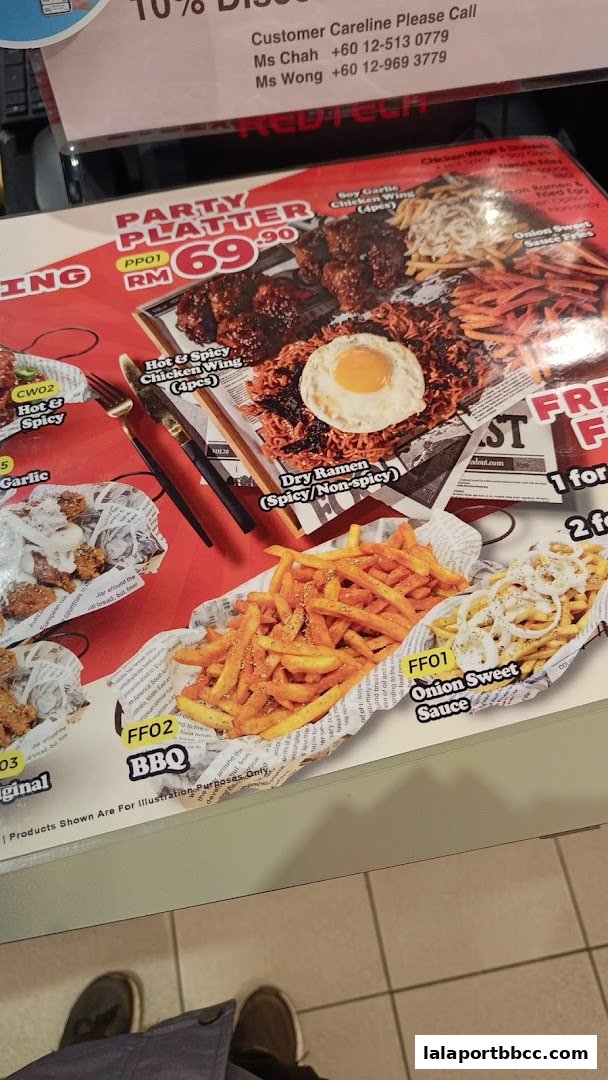 A menu featuring a party platter, chicken wings, ramen, and fries with various sauces.