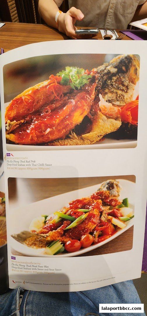 A menu page showcasing two deep-fried seabass dishes with different sauces.