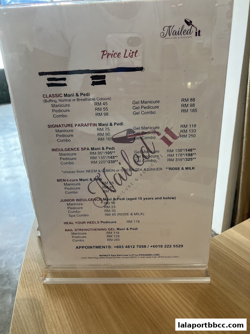 A price list for manicure and pedicure services at Nailed It.