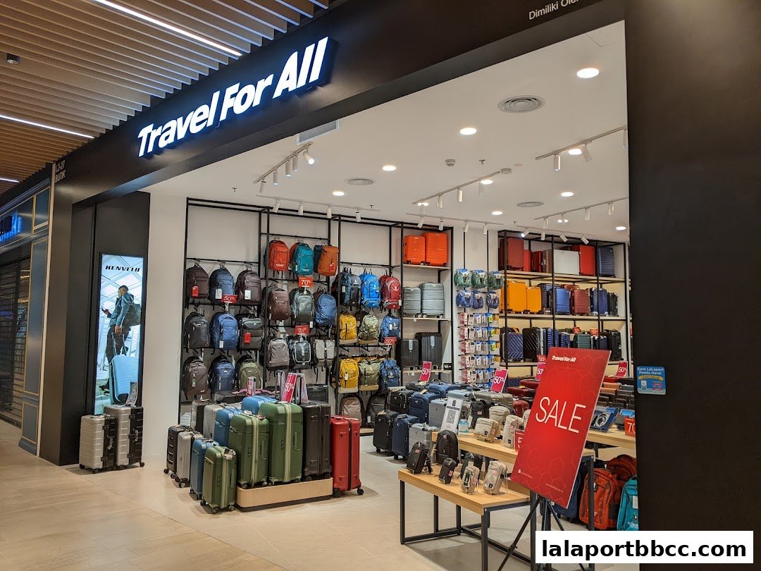 A well-lit travel store showcasing a wide variety of luggage and backpacks.