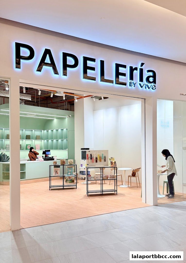 The entrance of Papeleria by VIVE, a stationery shop with a clean and modern interior.