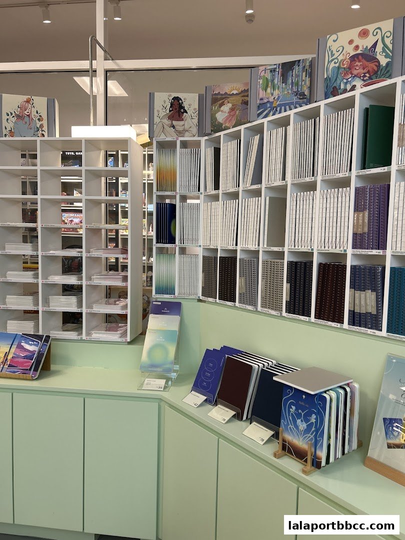 A retail shop interior displaying a wide selection of notebooks and journals on shelves.