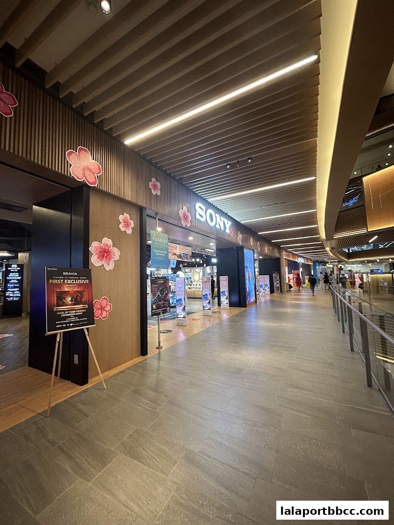 The entrance of the Sony Store BBCC, decorated with cherry blossoms, showcasing electronics.