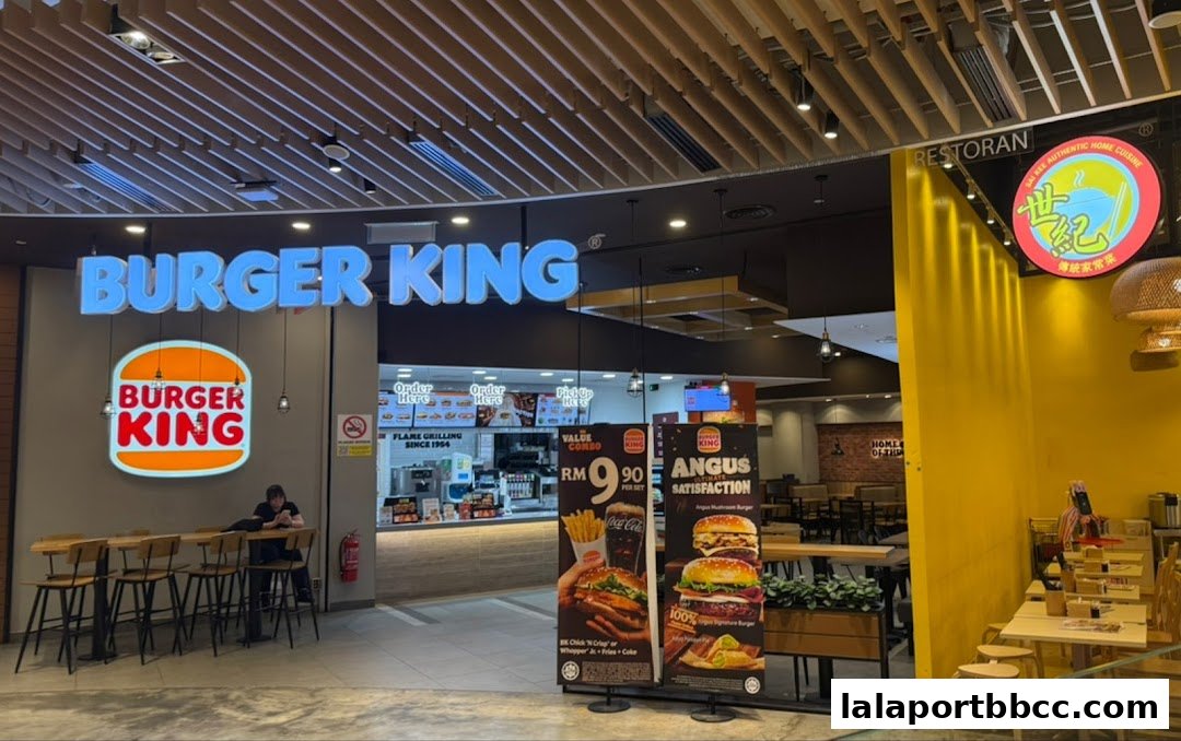 Burger King restaurant entrance with prominent signage and promotional displays.