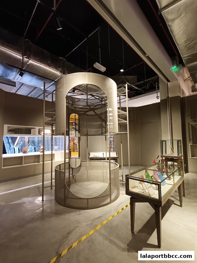 Interior view of a modern retail space with unique architectural displays and glass display cases.
