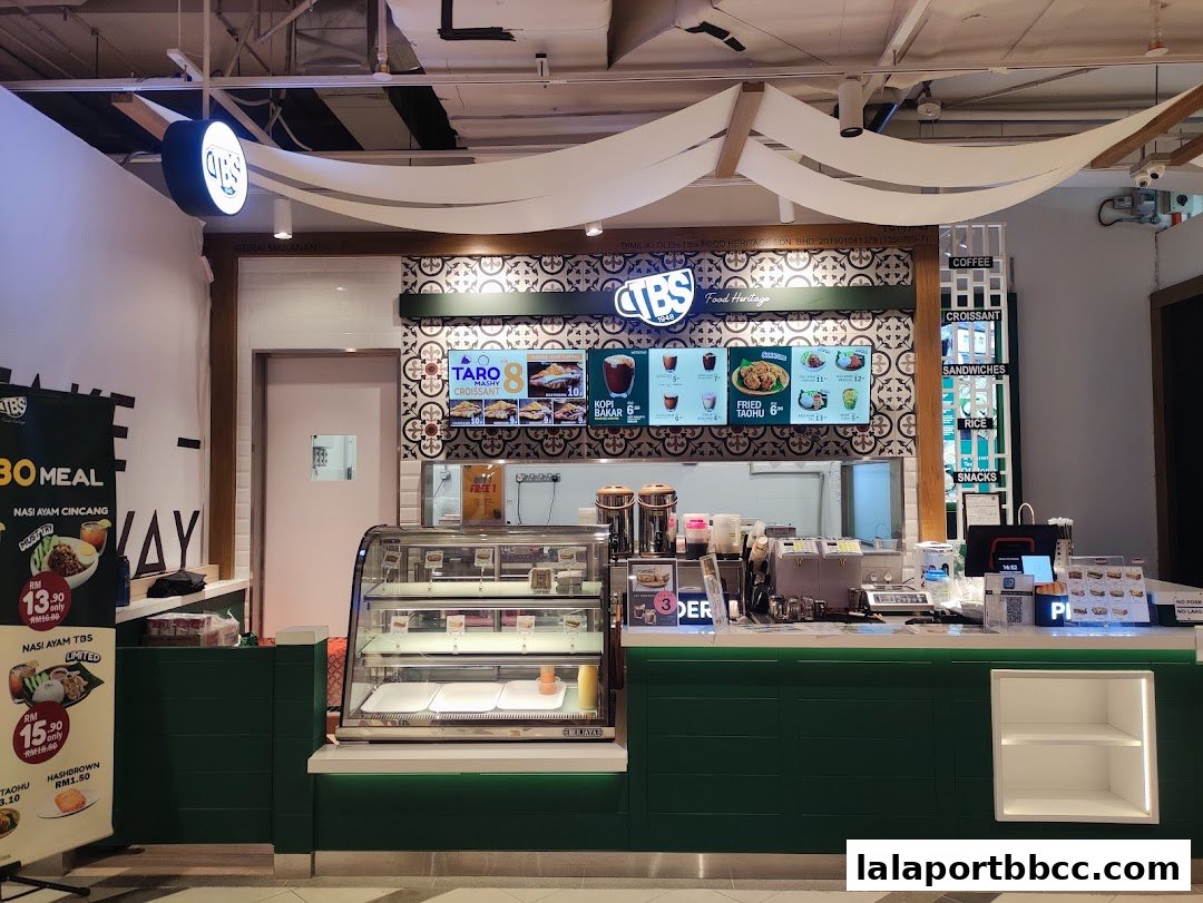The TBS Food Heritage shop counter with digital menus and display cases.