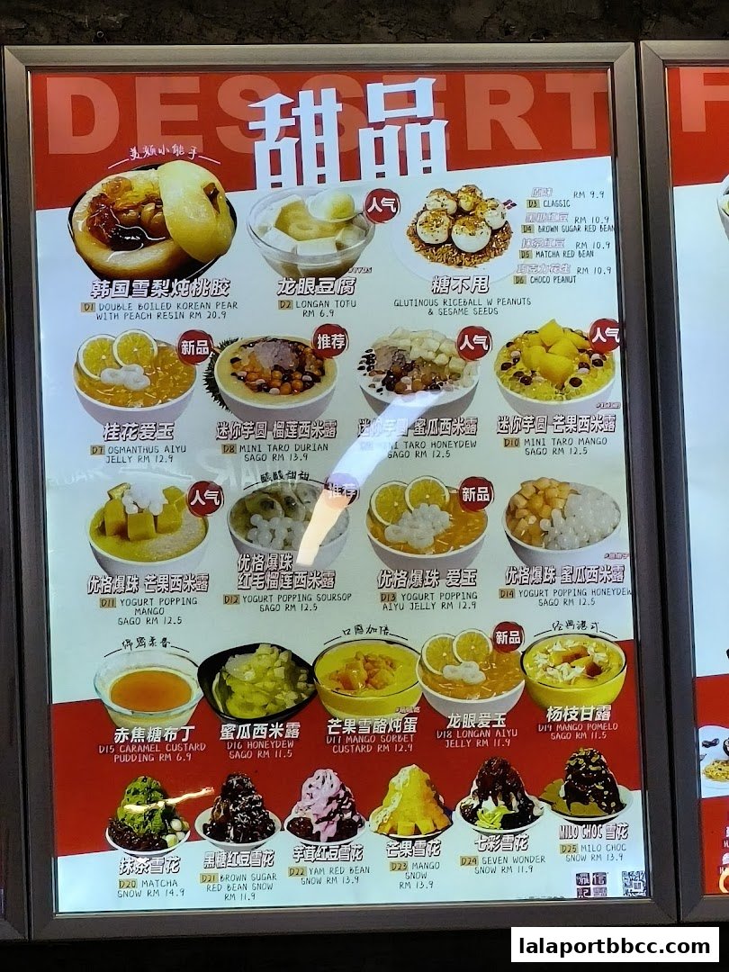 A brightly lit menu board showcasing a variety of colorful and appealing Asian desserts.