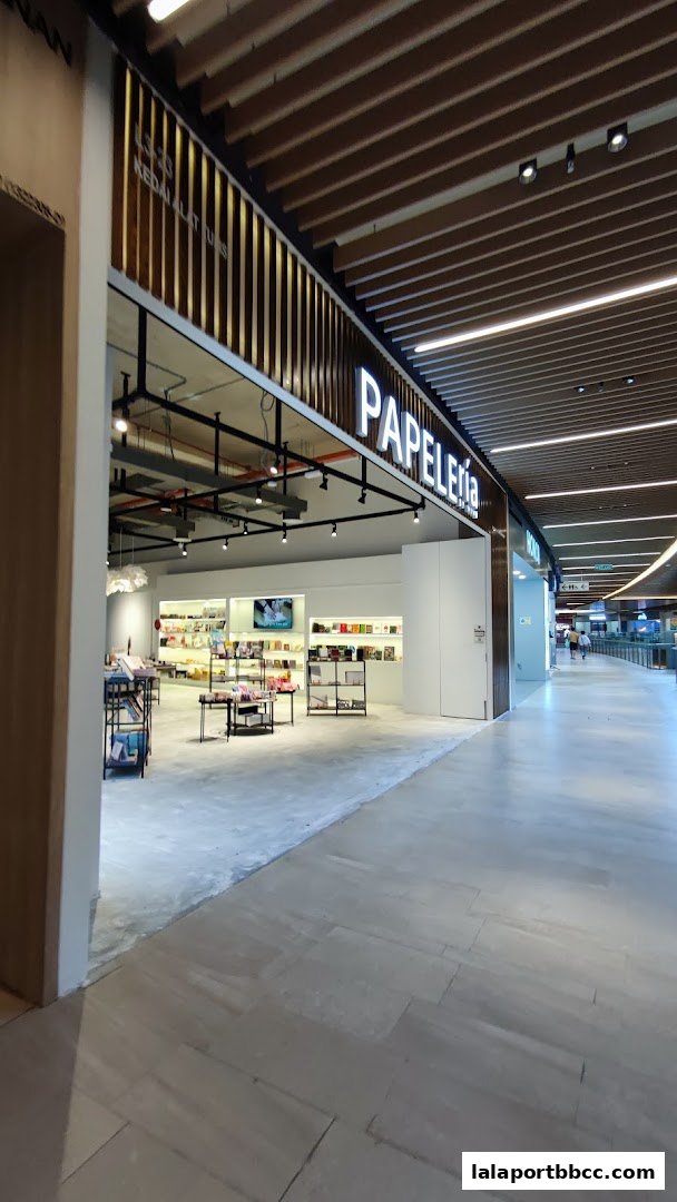 The entrance to Papeleria by VIVE, a stationery shop, showcasing its well-lit interior and merchandise.