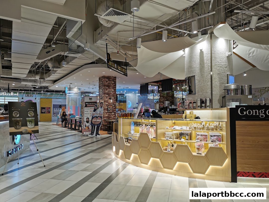 A modern bubble tea shop with a display of products and a counter.