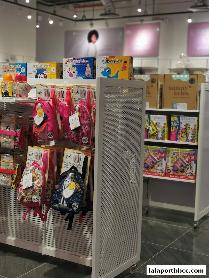 A retail display featuring children's backpacks, toys, and puzzles.