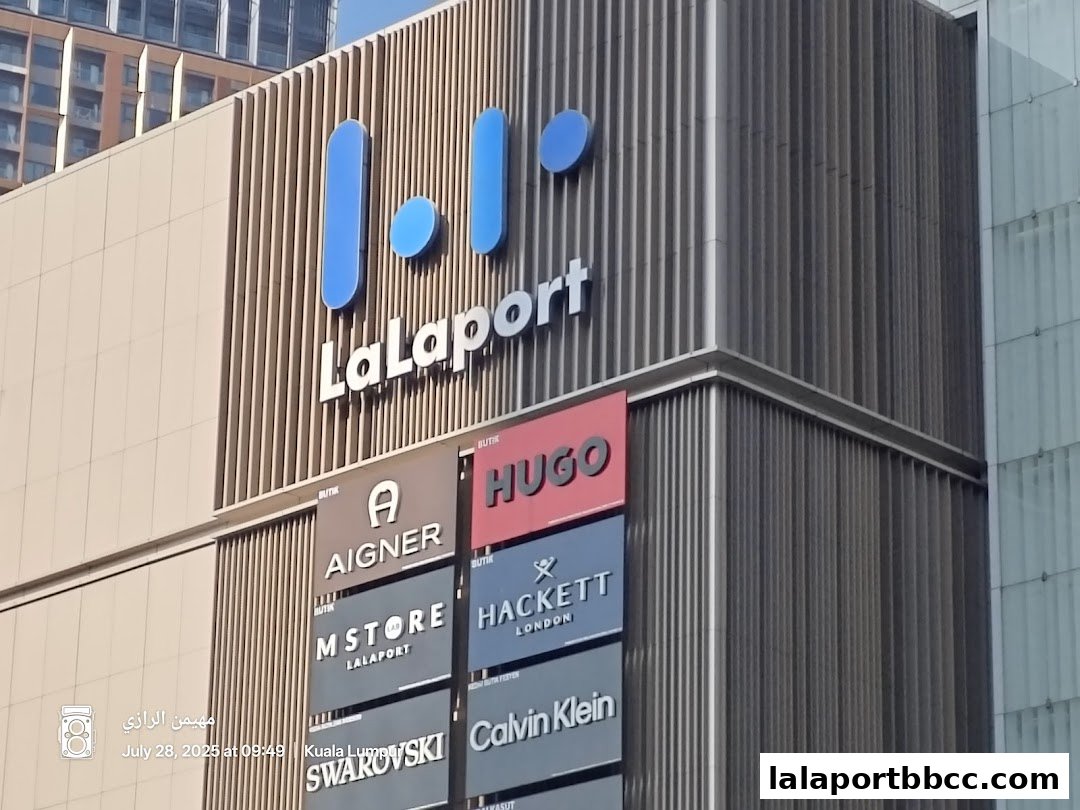 Exterior view of LaLaport KL mall with various brand storefronts visible.