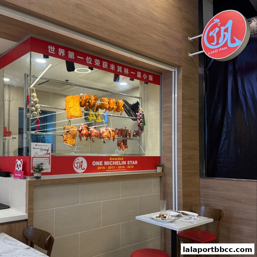 A shop front displaying roasted meats and a Michelin Star award.